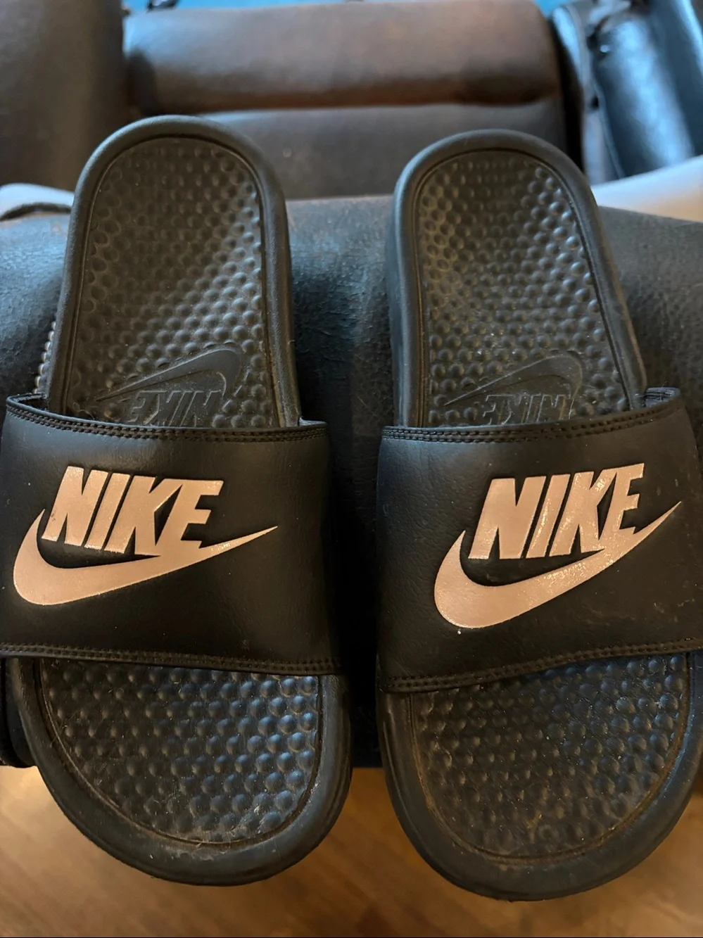 Nike Black Slide Sandals with Metallic Rose Gold Logo